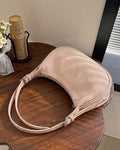 StyleShoot's Minimal Curved Shoulder Bag in Beige