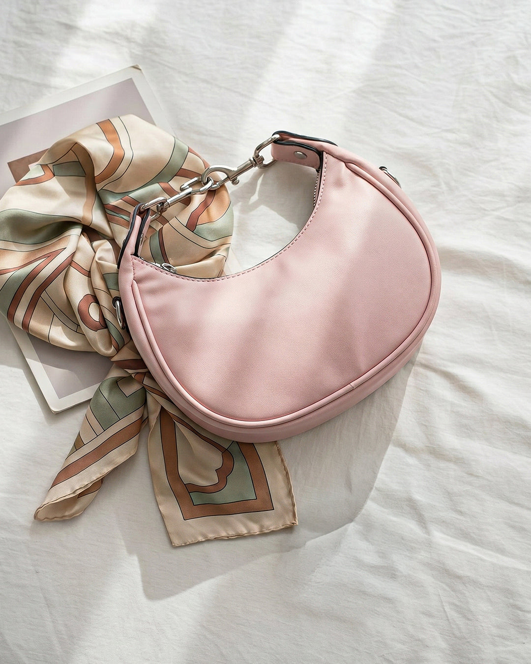 StyleShoot's Stylish Crescent Carry Sling Bag in Baby Pink