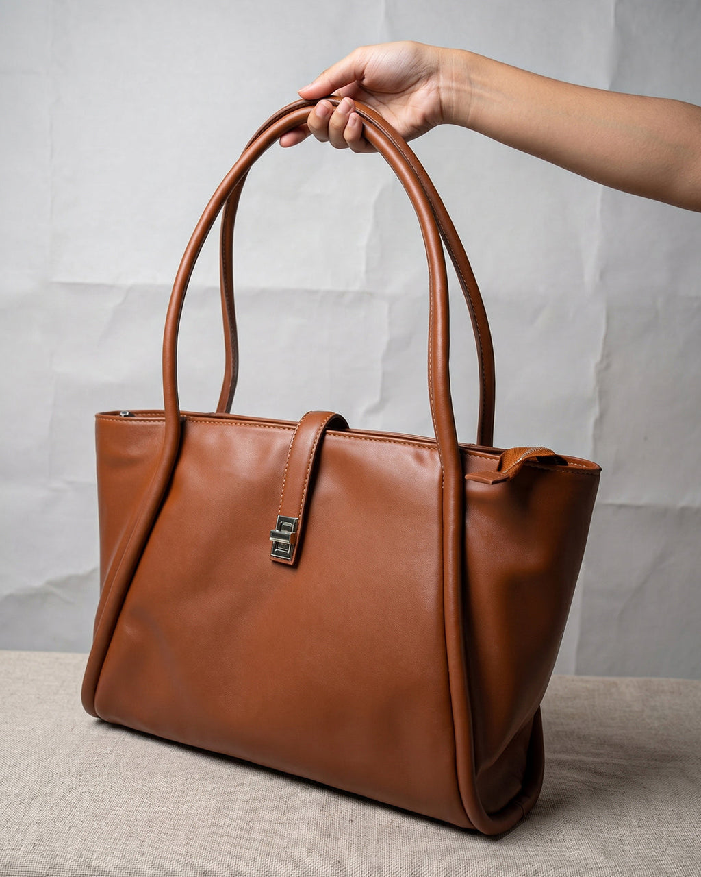 StyleShoot's Minimalist Turn Lock Tote Bag in Rust Brown